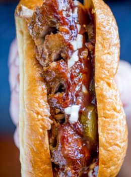 Slow Cooker McRib Sandwiches with an amazing baby back rib meat topped with the classic McDonald's bbq sauce, onions and pickles.