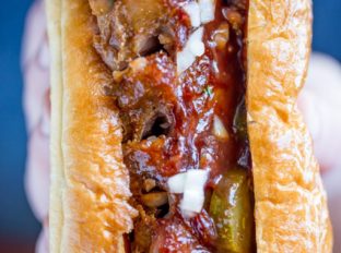 Slow Cooker McRib Sandwiches with an amazing baby back rib meat topped with the classic McDonald's bbq sauce, onions and pickles.
