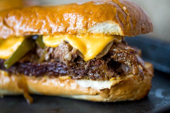 Slow Cooker Philly Cheese Steak Sandwiches that are so tender and flavorful you'll feel like you're in Philly. Perfect for a crowd!