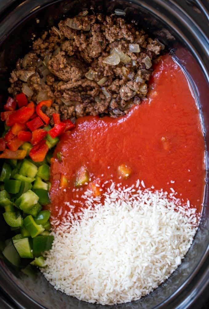 Slow Cooker Stuffed Pepper Soup is made with ground beef, bell peppers, onions and tomato sauce. All the flavors of your favorite stuffed peppers with half the effort. 