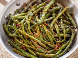 Spicy Sichuan Green Beans are the perfect easy side dish to your favorite Chinese meal and they're a breeze to make with just a few ingredients.