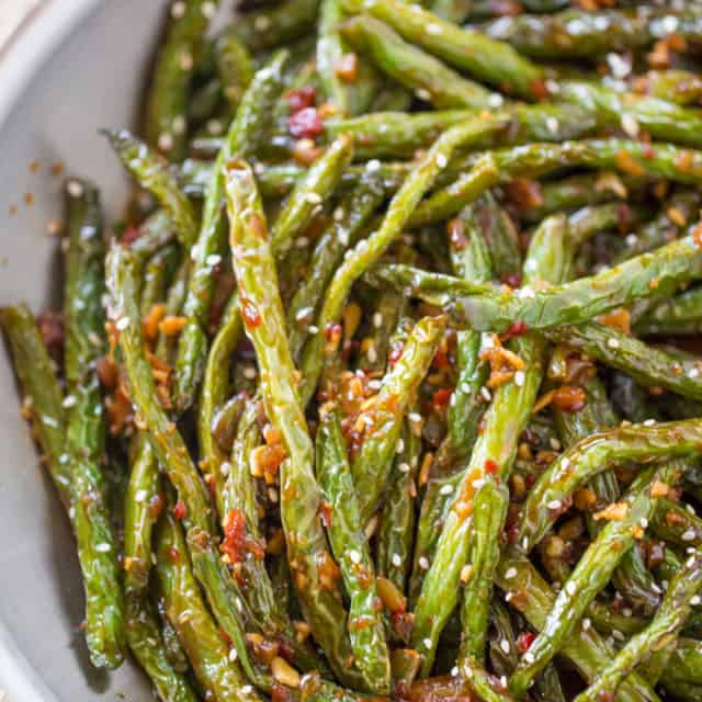 Spicy Sichuan Green Beans are the perfect easy side dish to your favorite Chinese meal and they're a breeze to make with just a few ingredients.