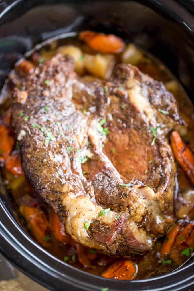 Ultimate Slow Cooker Pot Roast that leaves you with tender meat, vegetables and a built in gravy to enjoy them all with in just 15 minutes of prep! Perfect weeknight dinner!