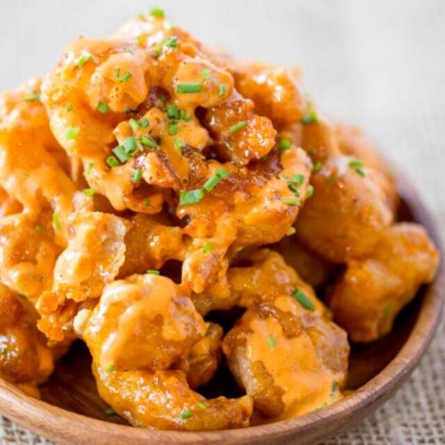 Bang Bang Shrimp finished shrimp in wooden bowl.