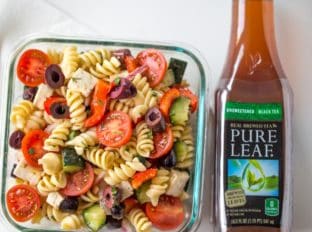 Easy Greek Pasta Salad with a homemade vinaigrette, pasta, feta, and olives is the perfect, easy lunch meal you can enjoy at room temperature. Also great with added chicken or shrimp.