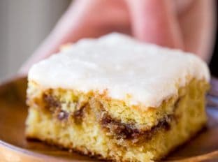 Honey Bun Cake with no cake mix, tastes like the classic honey buns you loved as a kid and like your favorite yellow cake growing up. Perfect for brunch and holiday parties.
