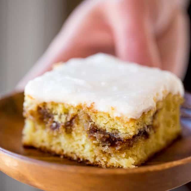 Honey Bun Cake with no cake mix, tastes like the classic honey buns you loved as a kid and like your favorite yellow cake growing up. Perfect for brunch and holiday parties.