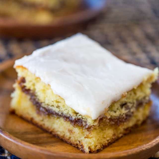 Honey Bun Cake with no cake mix, tastes like the classic honey buns you loved as a kid and like your favorite yellow cake growing up. Perfect for brunch and holiday parties.