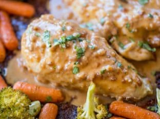 Sheet Pan Peanut Chicken and Vegetables is an easy, but authentic weeknight dinner with almost no cleanup! Serve with rice or noodles.