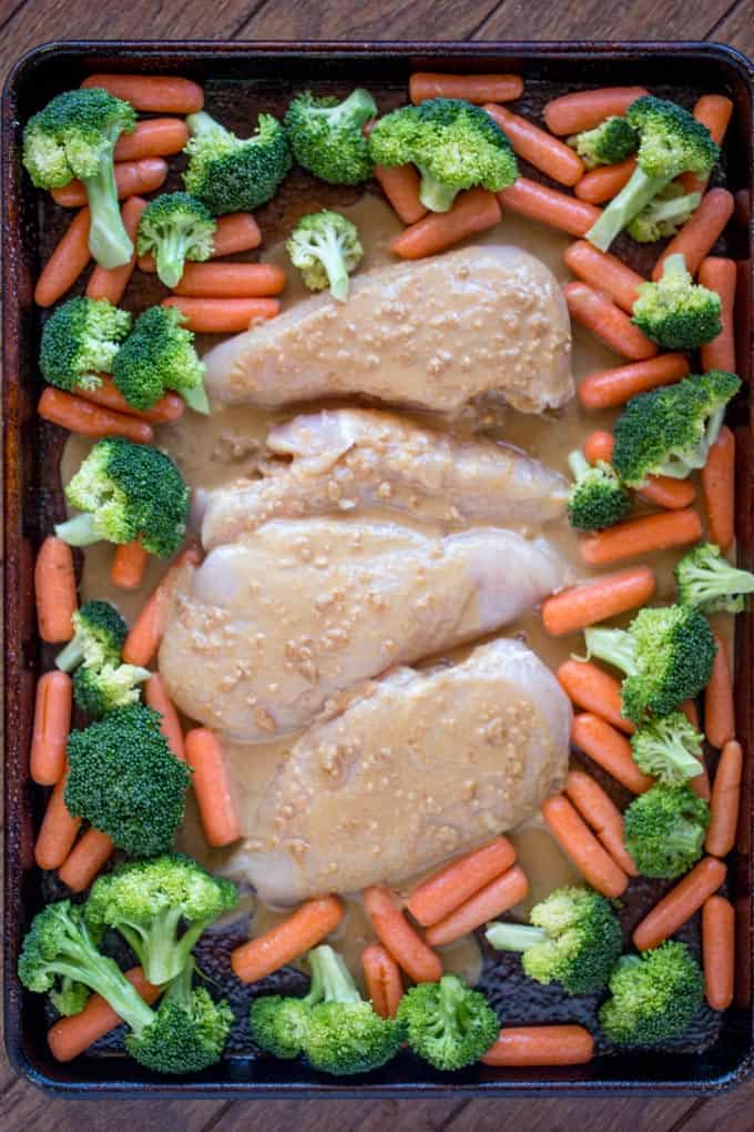 Sheet Pan Peanut Chicken and Vegetables is an easy, but authentic weeknight dinner with almost no cleanup! Serve with rice or noodles.