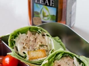Slow Cooker Chicken Caesar Salad Wraps with shredded chicken, an easy anchovy free caesar dressing, croutons, tomatoes and Parmesan cheese in a spinach tortilla. Perfect for your lunchbox!