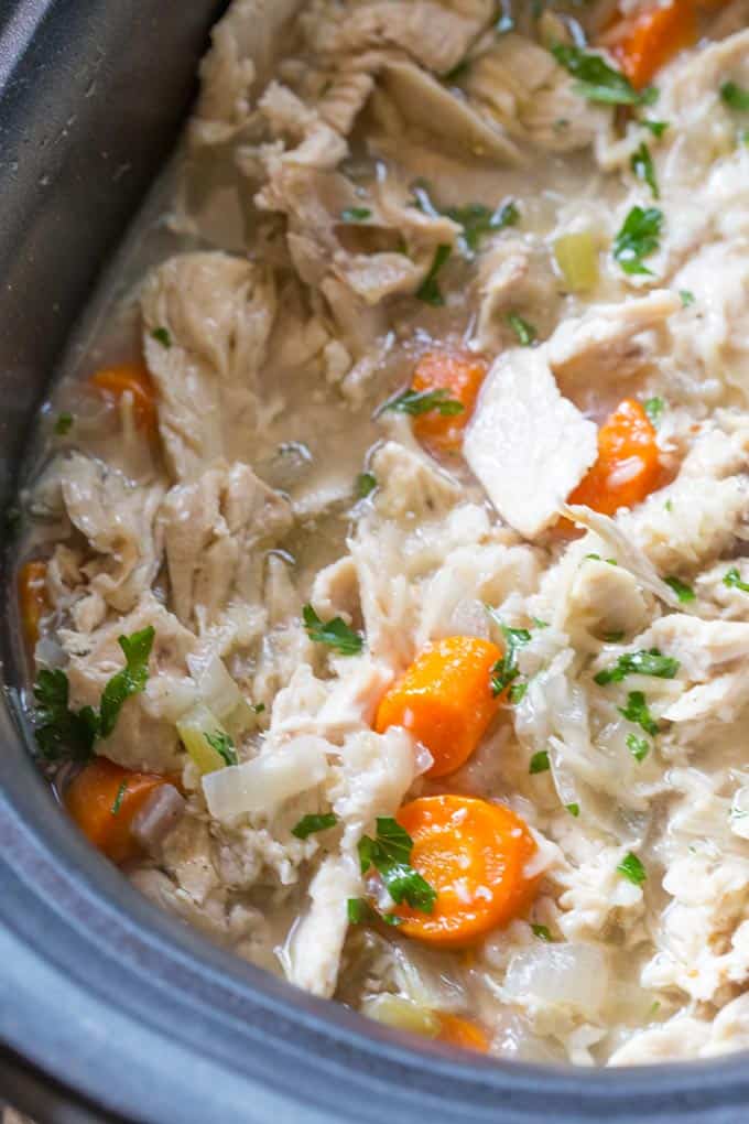 Slow Cooker Chicken and Rice Soup with lemon, brown rice and chicken breasts.