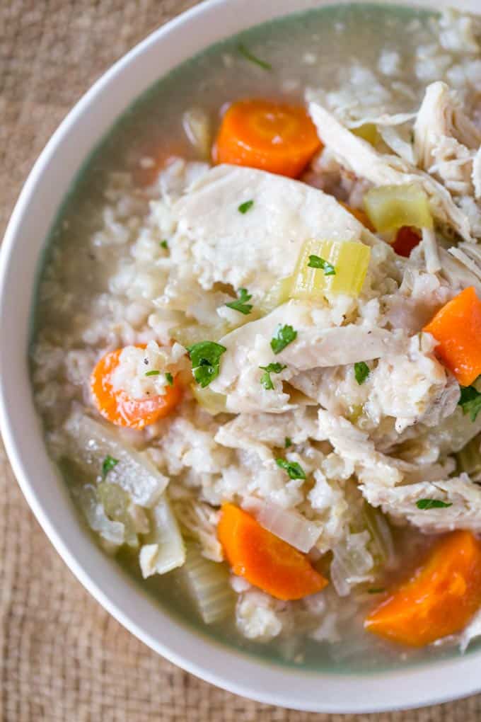 Slow Cooker Chicken and Rice Soup with lemon, brown rice and chicken breasts.