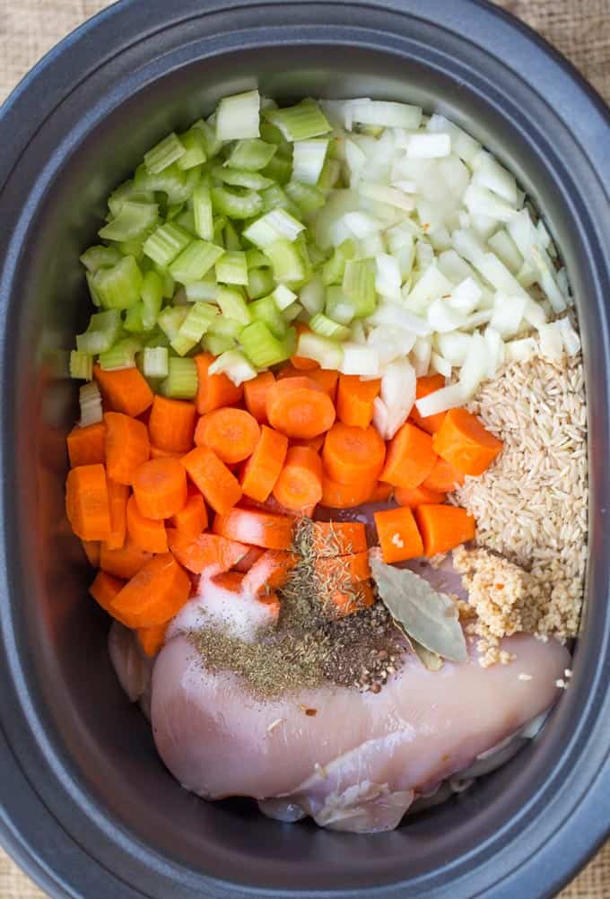 Slow Cooker Chicken and Rice Soup with lemon, brown rice and chicken breasts.