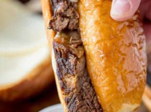 Slow Cooker French Dip Sandwiches are the ultimate sandwich made with your favorite beer with thick slices that are super tender with an amazing crust.