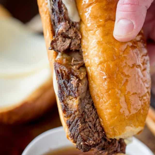Slow Cooker French Dip Sandwiches are the ultimate sandwich made with your favorite beer with thick slices that are super tender with an amazing crust.