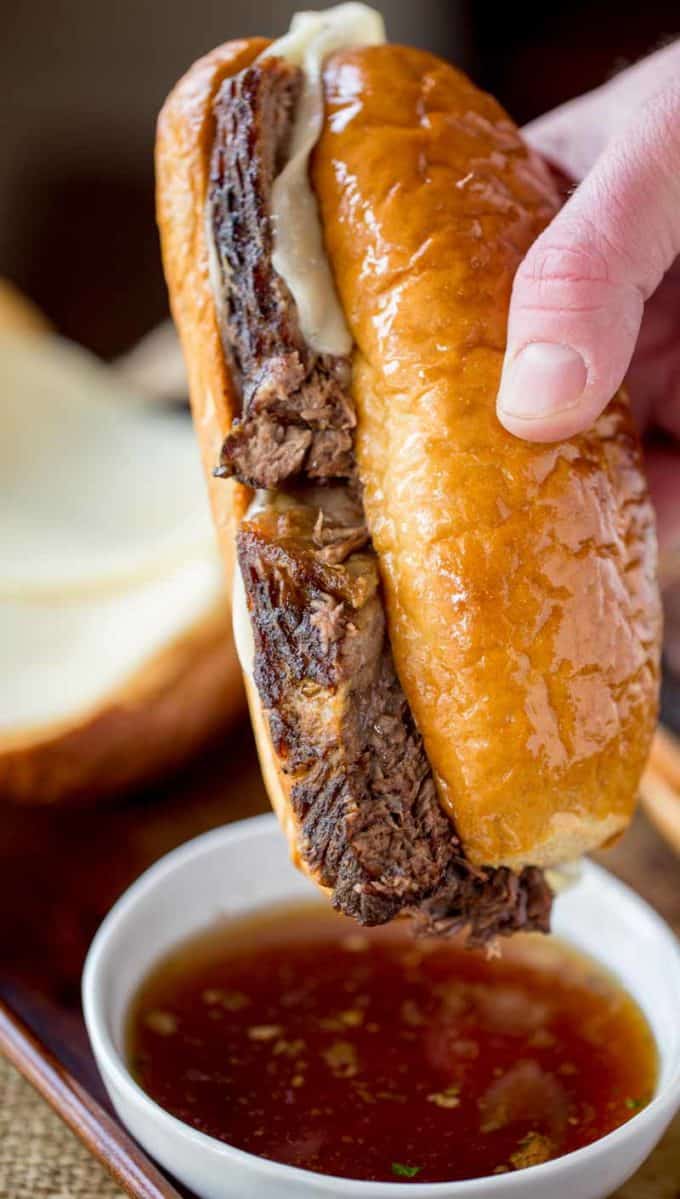 Slow Cooker French Dip Sandwiches are the ultimate sandwich made with your favorite beer with thick slices that are super tender with an amazing crust.