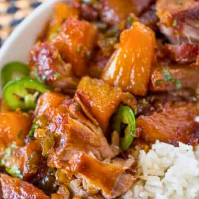 Bowl of rice and a pork and pineapple dish