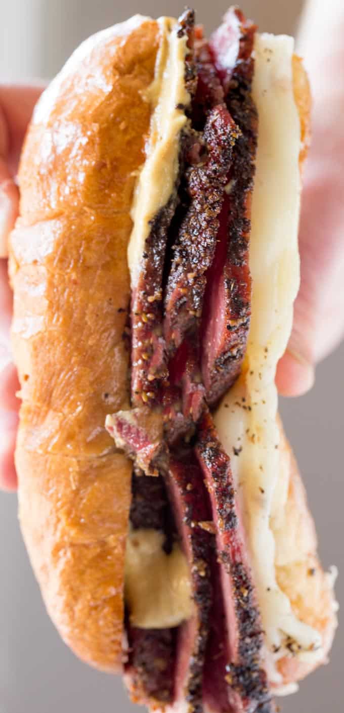 Slow Cooker Pastrami Sandwiches are easy to make for a crowd or for your lunches and takes just a few ingredients. You'll never buy deli pastrami again!