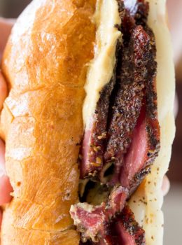 Slow Cooker Pastrami Sandwiches are easy to make for a crowd or for your lunches and takes just a few ingredients. You'll never buy deli pastrami again!