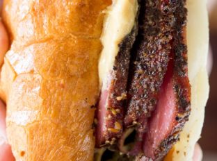 Slow Cooker Pastrami Sandwiches are easy to make for a crowd or for your lunches and takes just a few ingredients. You'll never buy deli pastrami again!