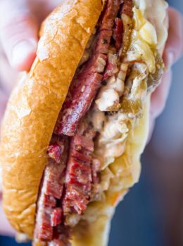 Slow Cooker Reuben Sandwiches are perfect for leftover corned beef after your St. Patrick's Day dinner with a quick sauerkraut, Swiss cheese and thousand island dressing.
