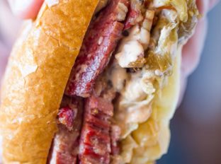 Slow Cooker Reuben Sandwiches are perfect for leftover corned beef after your St. Patrick's Day dinner with a quick sauerkraut, Swiss cheese and thousand island dressing.