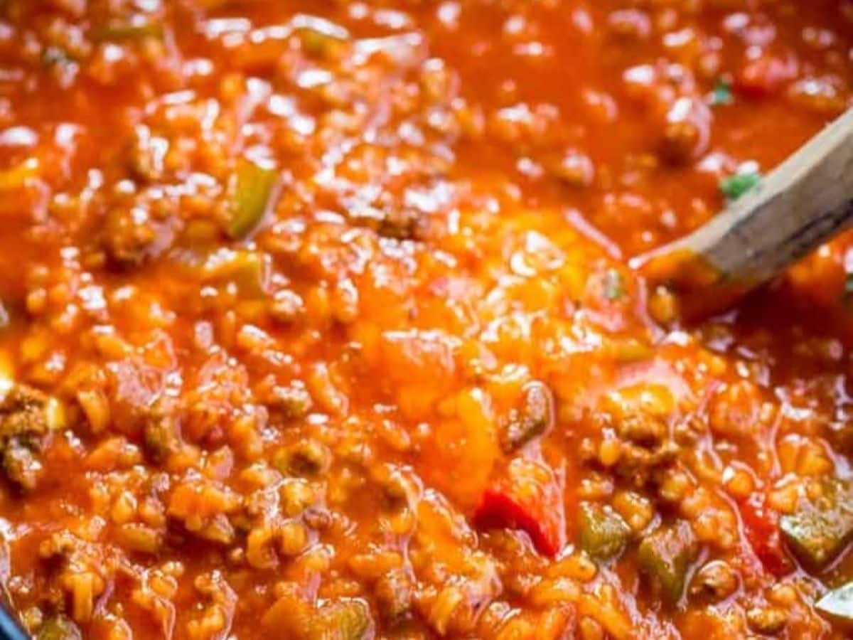Slow Cooker Stuffed Pepper soup in a pot with a ladle.