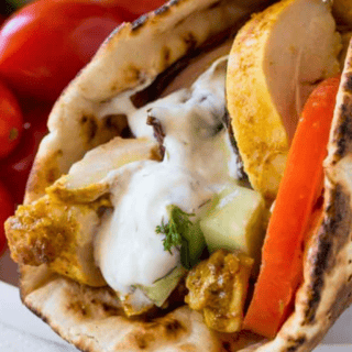 Pita Wrap with chicken tomatoes and sauce