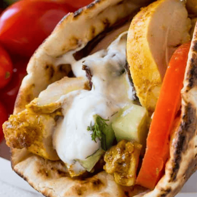 Pita Wrap with chicken tomatoes and sauce