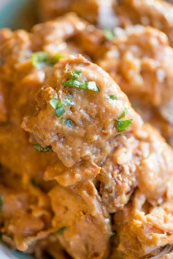 Slow Cooker Thai Peanut Chicken is an easy weeknight meal made with coconut milk, lime juice, peanut butter, ginger and garlic. Skip the delivery!