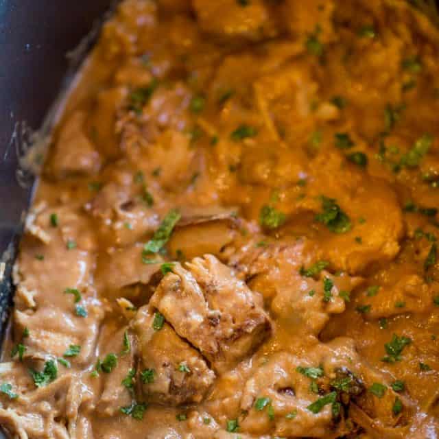 Slow Cooker Thai Peanut Chicken is an easy weeknight meal made with coconut milk, lime juice, peanut butter, ginger and garlic. Skip the delivery!
