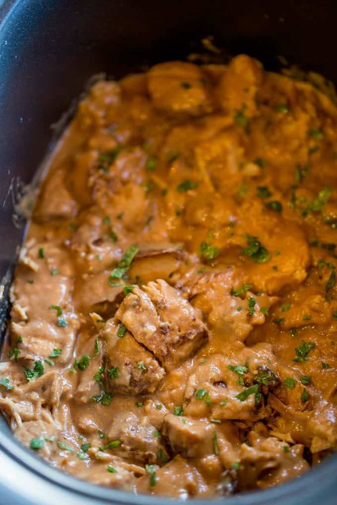 Slow Cooker Thai Peanut Chicken is an easy weeknight meal made with coconut milk, lime juice, peanut butter, ginger and garlic. Skip the delivery!