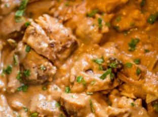 Slow Cooker Thai Peanut Chicken is an easy weeknight meal made with coconut milk, lime juice, peanut butter, ginger and garlic. Skip the delivery!