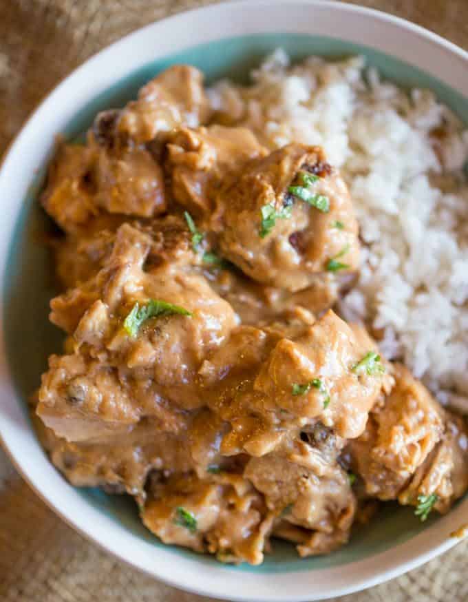 Slow Cooker Thai Peanut Chicken is an easy weeknight meal made with coconut milk, lime juice, peanut butter, ginger and garlic. Skip the delivery!