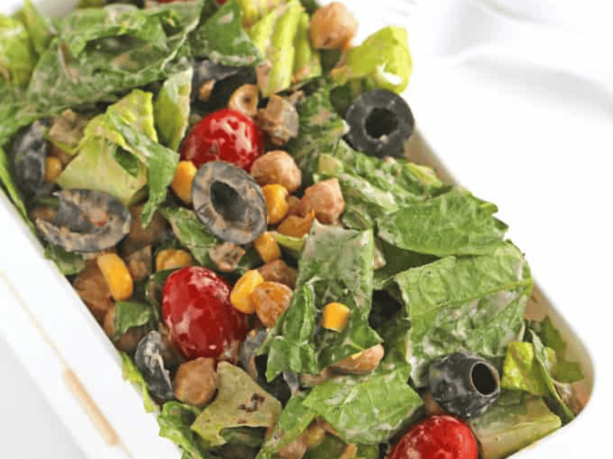 completed salad in a salad container