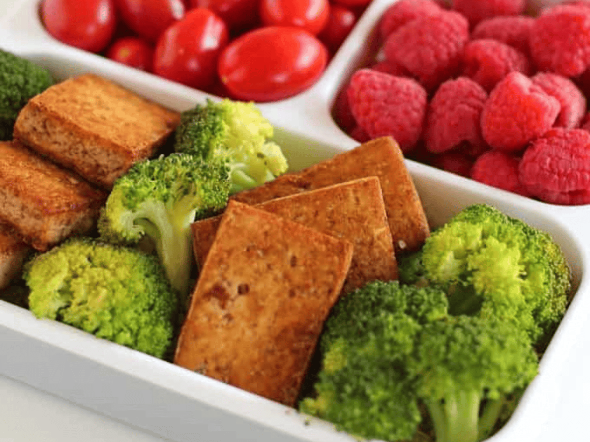 close up on tofu, fruit, and veggies