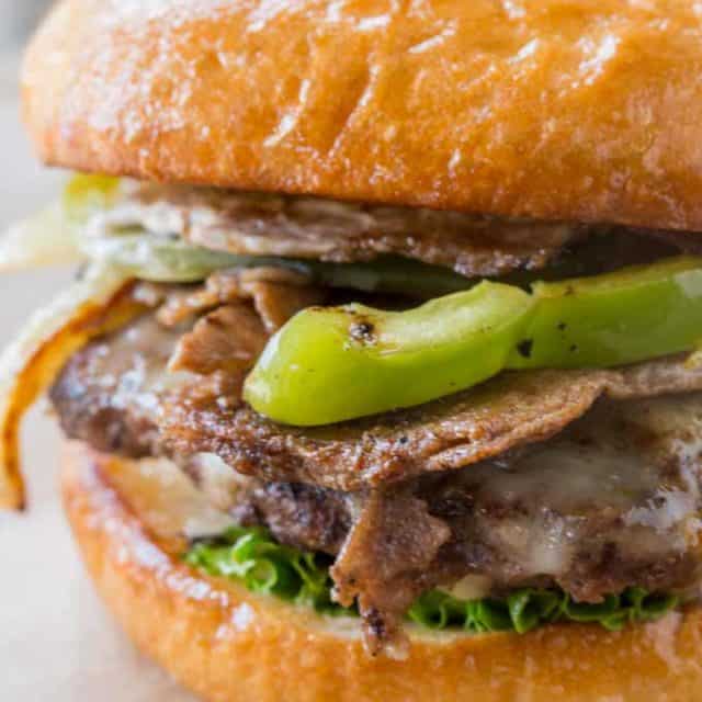 Philly Cheese Steak Burger made with thinly sliced ribeye and veggies.