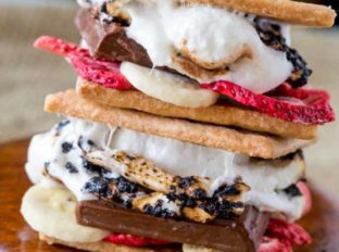 Banana Split S'mores are a crunchy, melty, sweet and tart summer treat with chocolate, graham crackers, marshmallows and freeze dried fruits.