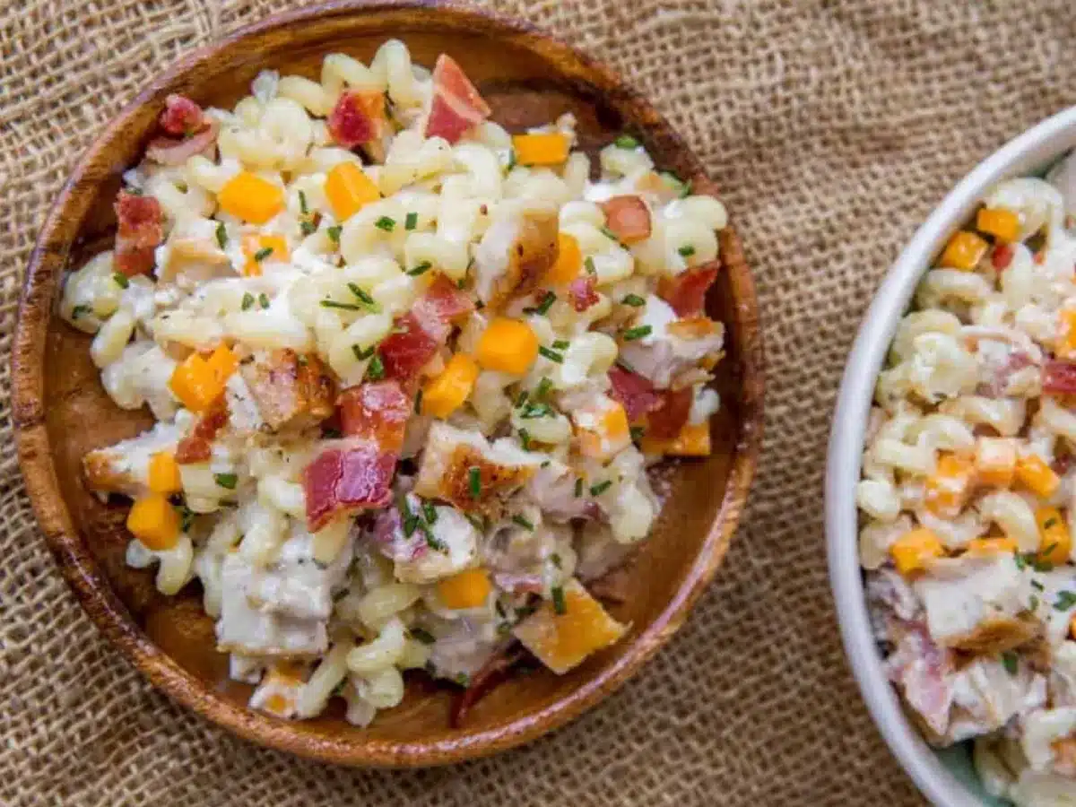 Pasta salad served in wooden bowl