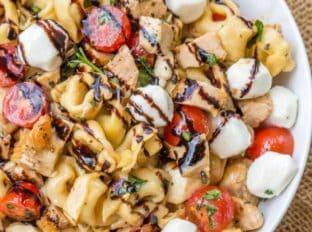 Chicken Caprese Tortellini Pasta Salad is the perfect and quick pasta salad for your summer cookout with chicken, fresh mozzarella, tortellini and quick balsamic dressing.