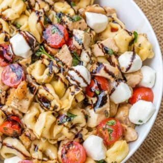 Chicken Caprese Tortellini Pasta Salad is the perfect and quick pasta salad for your summer cookout with chicken, fresh mozzarella, tortellini and quick balsamic dressing.