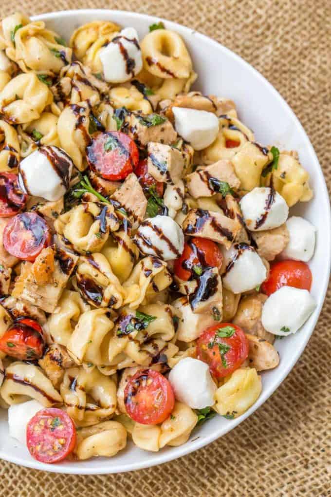 Chicken Caprese Tortellini Pasta Salad is the perfect and quick pasta salad for your summer cookout with chicken, fresh mozzarella, tortellini and quick balsamic dressing.