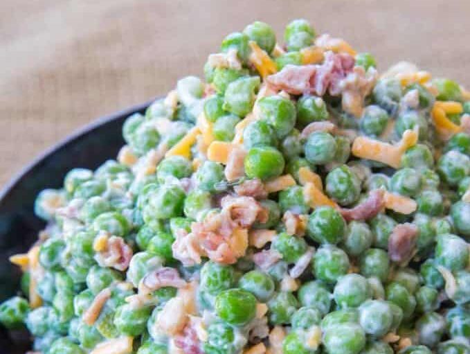 Salad with mayonnaise, bacon, cheddar cheese and crunch peas.