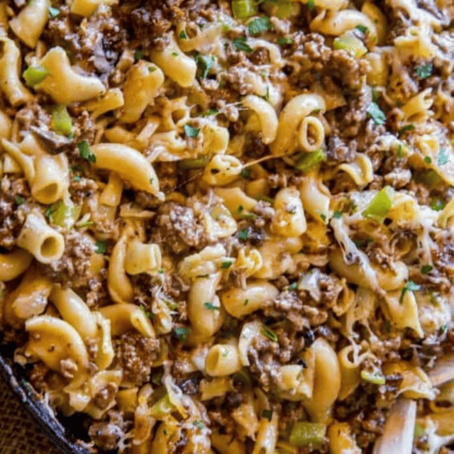 Black skillet of pasta and beef dish