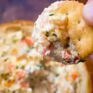 Diip on Ritz cracker over cooked dip in bread bowl