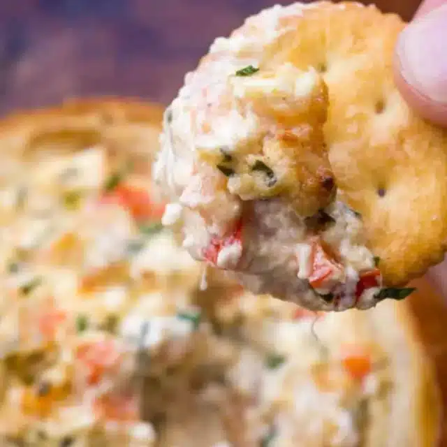 Diip on Ritz cracker over cooked dip in bread bowl