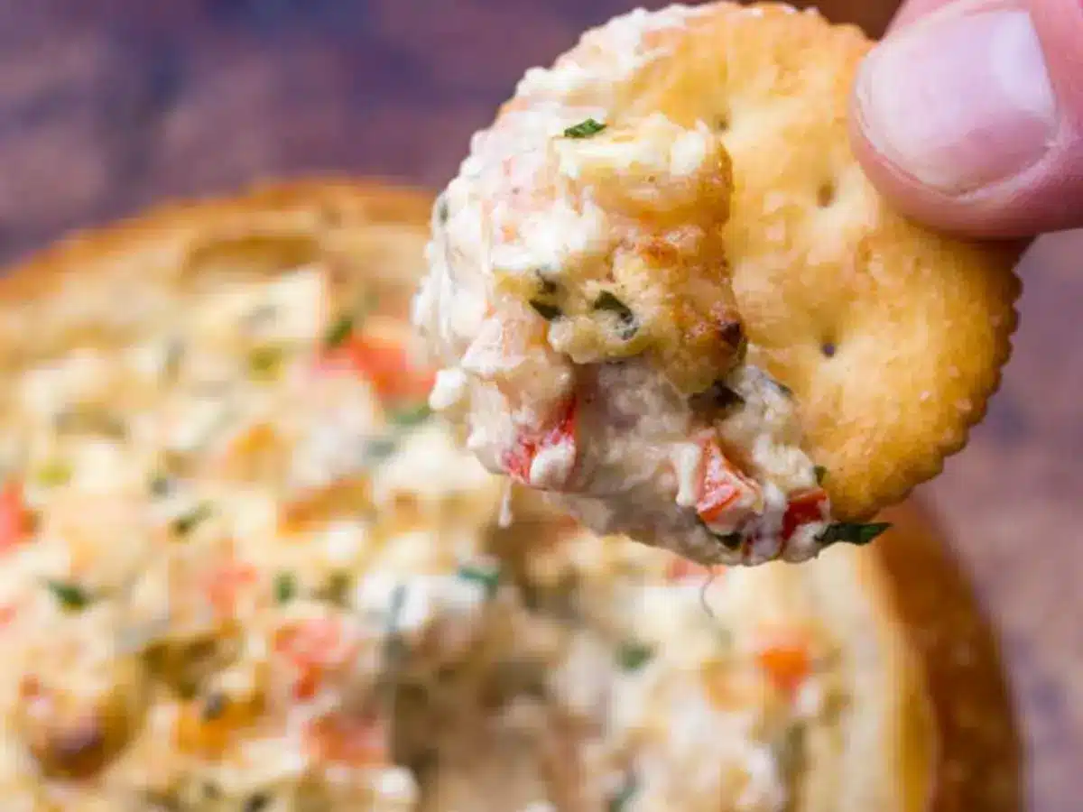 Diip on Ritz cracker over cooked dip in bread bowl