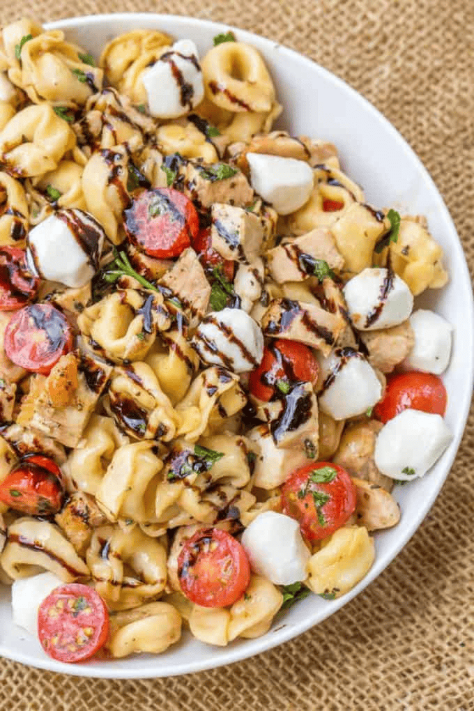 Finished Italian pasta salad in a white serving bowl