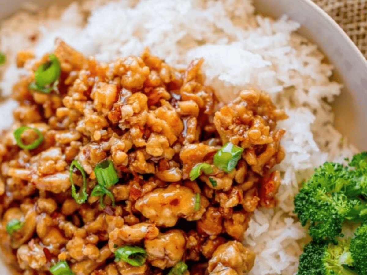 chicken served on plate with rice